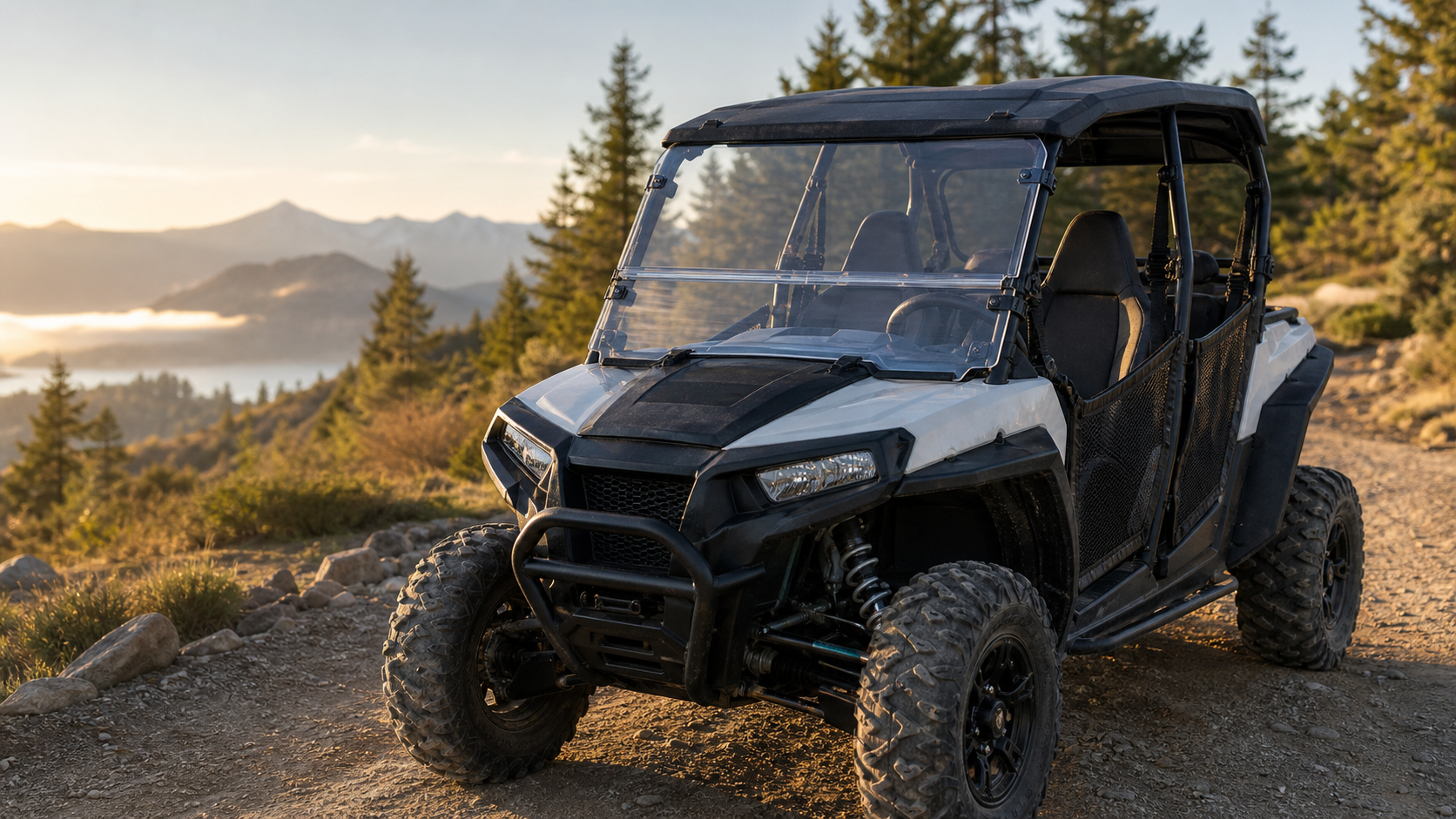 Utility UTV with windshield parked outdoors near a trailhead